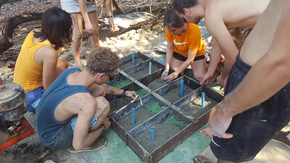 Volunteers doing concrete